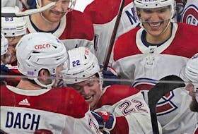 Canadiens' Kirby Dach (77) celebrates the game-winning goal against the Chicago Blackhawks during a shootout at United Center in Chicago on Friday, Nov. 25, 2022. 