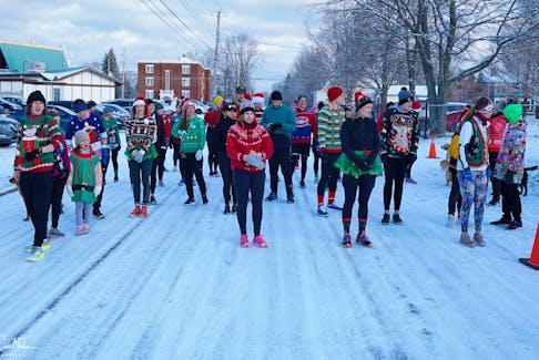Runners from the Ugly Christmas Sweater Run in December 2021.