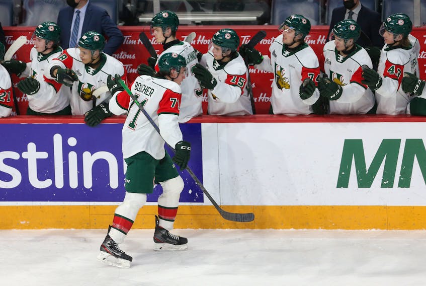 Halifax Mooseheads Evan Boucher taps gloves with teammates following his 2nd period goal against the Saint John Sea Dogs during QMJHL action in Halifax Thursday February 24, 2022.

TIM KROCHAK PHOTO