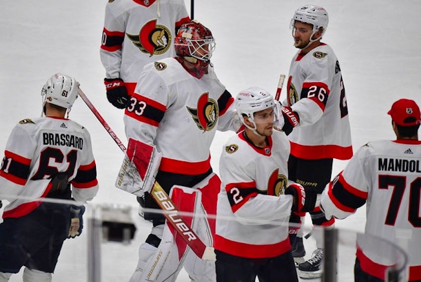 Ottawa Senators players celebrate the victory over the Anaheim Ducks on Friday at the Honda Center.