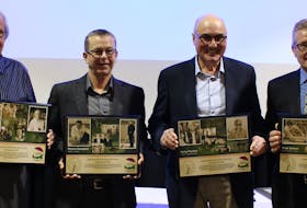 Dave Holland, left, Robert Campbell, Harry Polton and Peter Gallant pose with their P.E.I Sports Hall of Fame award plaques they received in an induction ceremony in Charlottetown Nov. 25. The plaques will be on display at the P.E.I. Sports Hall of Fame in Summerside. Grant Harrison • Special to The Guardian