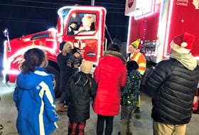 Santa Claus was happy to talk to people outside of Belly Busters pizza in Membertou on Nov. 23 as he made the rounds in the Coca-Cola Christmas truck. NICOLE SULLIVAN/CAPE BRETON POST