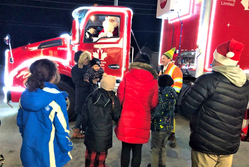Santa Claus was happy to talk to people outside of Belly Busters pizza in Membertou on Nov. 23 as he made the rounds in the Coca-Cola Christmas truck. NICOLE SULLIVAN/CAPE BRETON POST