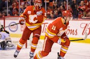  Calgary Flames’ Mikael Backlund celebrates a goal against the Boston Bruins with teammate Matthew Tkachuk in the Scotiabank Saddledome on Friday, February 21, 2020.
