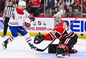 Nick Suzuki of the Montreal Canadiens scores in the shootout on Arvid Soderblom of the Chicago Blackhawks at United Center in Chicago on Nov. 25, 2022.