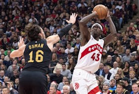 Raptors’ Pascal Siakam (right) scores on Cleveland Cavaliers’ Cedi Osman during the first half in Toronto on Monday, Nov. 28, 2022. 