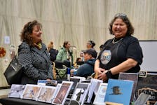 Patricia Bourque, a photographer, had one of dozens of booths set up at the Indigenous Artisans Christmas Market at the Confederation Centre in Charlottetown on Nov. 26. Logan MacLean • The Guardian