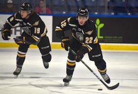 Olivier Houde of the Cape Breton Eagles, right, carries the puck up the ice during Quebec Major Junior Hockey League action at Centre 200 earlier this season. Houde is in his rookie campaign with the team. JEREMY FRASER/CAPE BRETON POST