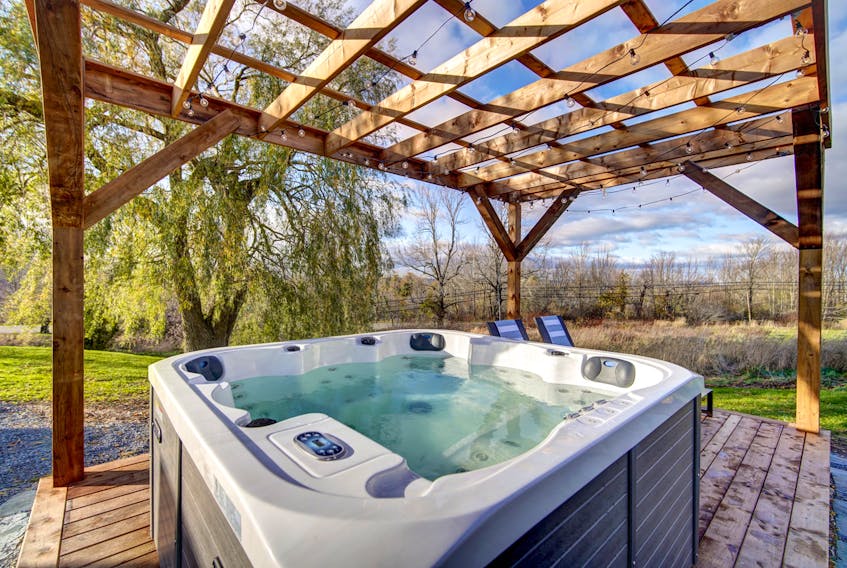 The Evangeline’s new hot tub has a pastoral location overlooking the Minas Basin.
