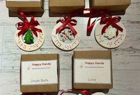 These Helping Hands ornaments, featuring words written in braille, will be sold at the second annual AccessABLE Holiday Craft Fair. They are created by mother-and-son duo Jamie and Griffin Patterson. Griffin, who was born premature, at 23-weeks, in 2006, is blind and has autism.