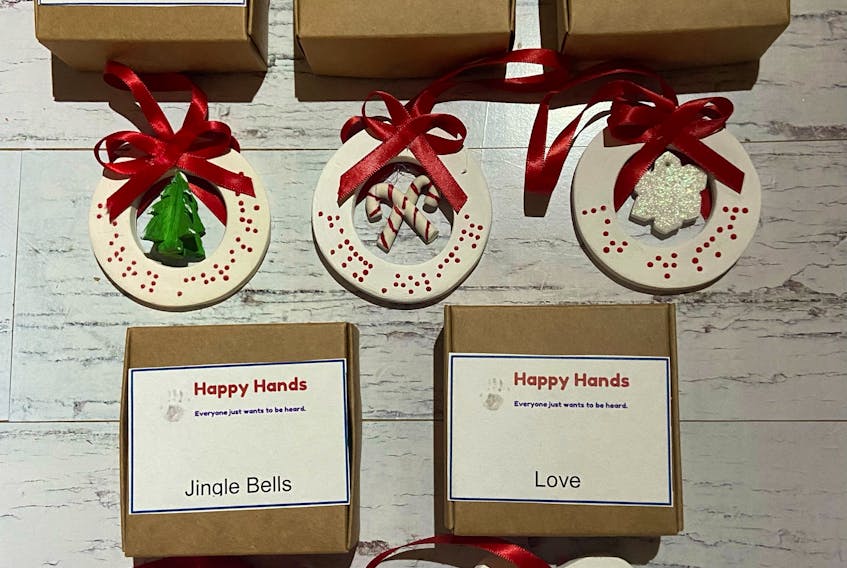 These Helping Hands ornaments, featuring words written in braille, will be sold at the second annual AccessABLE Holiday Craft Fair. They are created by mother-and-son duo Jamie and Griffin Patterson. Griffin, who was born premature, at 23-weeks, in 2006, is blind and has autism.