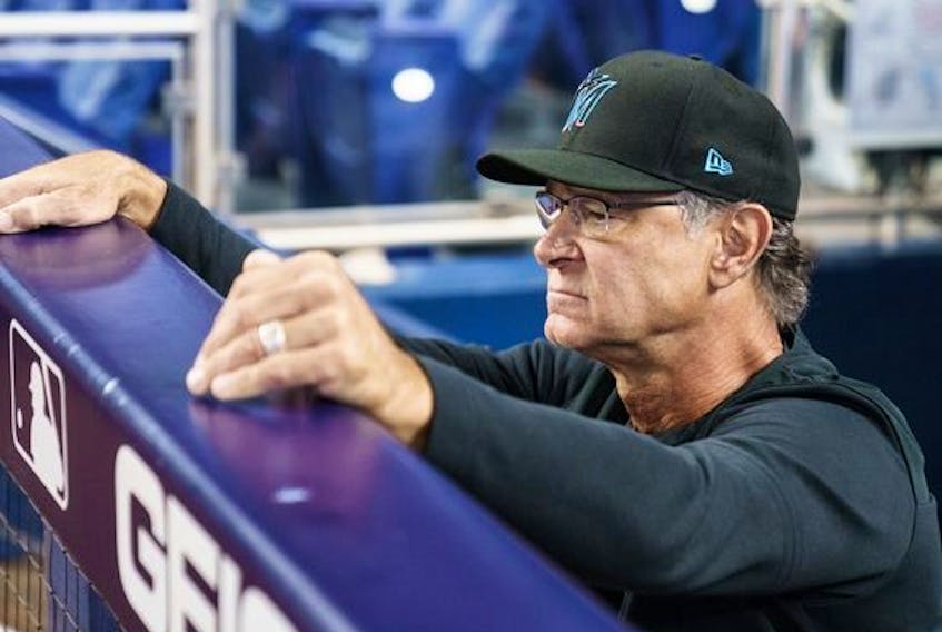 Don Mattingly looks out from the Miami Marlins dugout before the start of a game against the Washington Nationals at loanDepot park on Sept. 25, 2022 in Miami, Fla. 