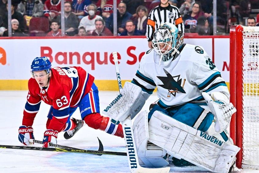 Sharks goaltender Kaapo Kahkonen prepares for a shot while Canadiens forward Evgenii Dadonov lurks nearby during game Tuesday night at the Bell Centre.