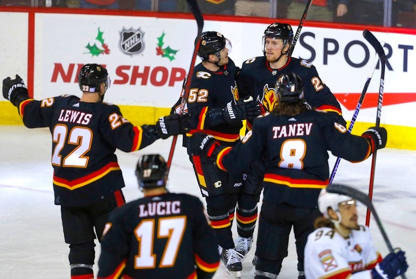 The Calgary Flames celebrate a goal by Brett Ritchie against the Florida Panthers at Scotiabank Saddledome in Calgary on Tuesday, Nov. 29, 2022. 