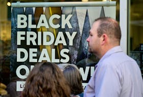 A sign highlights discounted items at the Outlet Shoppes of the Bluegrass in Simpsonville, Ky. Black Friday, the day after U.S. Thanksgiving, is a shopping phenomenon that has spread beyond that country's borders.