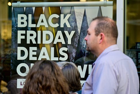 A sign highlights discounted items at the Outlet Shoppes of the Bluegrass in Simpsonville, Ky. Black Friday, the day after U.S. Thanksgiving, is a shopping phenomenon that has spread beyond that country's borders.