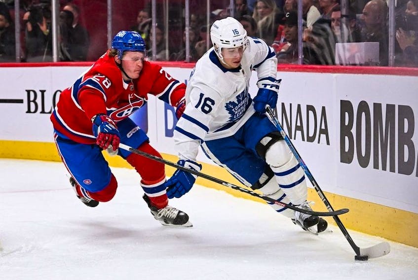 Montreal Canadiens center Christian Dvorak chases Toronto Maple Leafs right wing Mitch Marner along the boards during the first period at Bell Centre. 