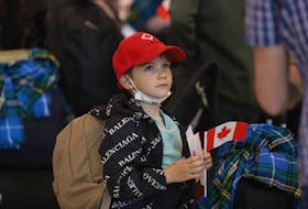 A young boy sporting his new Canada ball cap and Nova Scotian tartan waits in a queue for processing with his parents, some of the over 300 Ukrainian refugees that arrived in the province at Halifax Stanfield Airport Thursday June 2, 2022.
TIM KROCHAK PHOTO