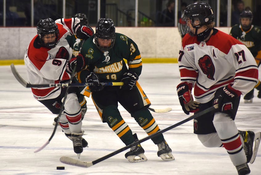 Jesse Ross of the Memorial Marauders, middle, works his way through a pair of Glace Bay Panthers teammates, Jesse Cathcart, left, and Lachlan Pilling during Mae Kibyuk Memorial Green and Gold Hockey Tournament action at Emera Centre Northside in North Sydney, Thursday. Glace Bay won the game 4-3. JEREMY FRASER/CAPE BRETON POST.