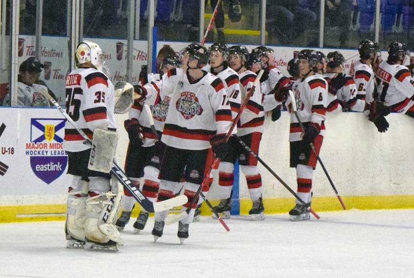 Crushers forward Bryson Boudreau celebrates his first goal of the night with goalie Jeremy Robar. Boudreau had a five-point night with a hat trick and two assists in the 8-1 win.