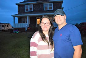 From left, Vanessa and Wayne Spencer stand outside their Glace Bay home Tuesday evening. Finishing their dream home has turned into a nightmare after the couple paid almost $24,000 to Raised Right General Contracting who have not done any work nor delivered the materials they allege were purchased. NICOLE SULLIVAN/CAPE BRETON POST