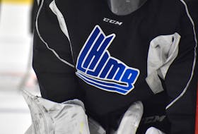 A goalie displays the QMJHL logo during a practice.