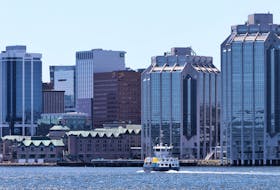 The metro transit ferry is seen with the Halifax skyline Monday, July 11, 2022