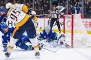  Nashville Predators’ Matt Duchene (95) has his shot blocked by Vancouver Canucks’ Ethan Bear (74) in front of goalie Thatcher Demko (35) during the first period on Saturday night.
