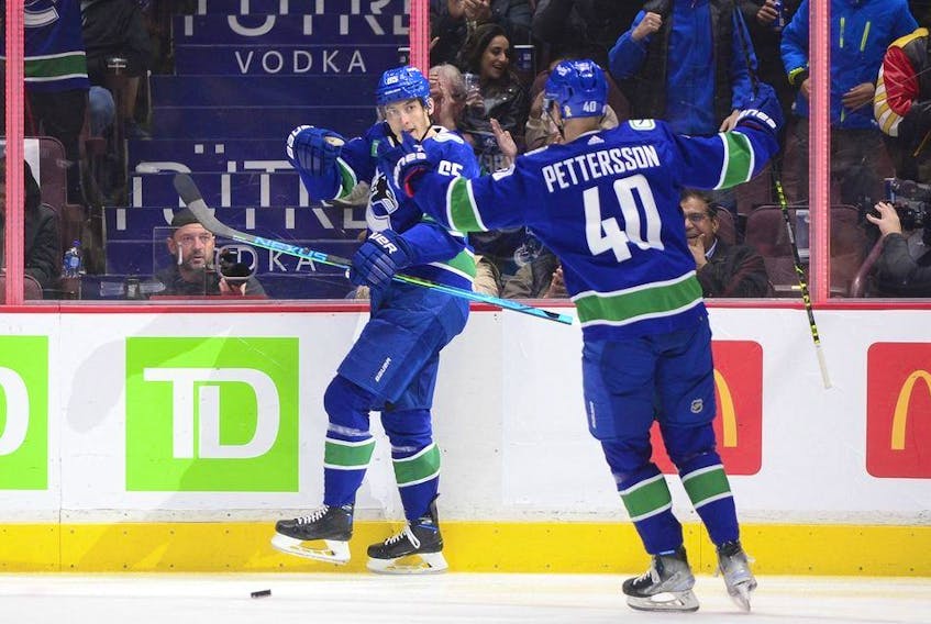  Vancouver Canucks forward Ilya Mikheyev (65) celebrates his goal against the Nashville Predators with forward Elias Pettersson (40) during the first period at Rogers Arena Nov. 5, 2022.