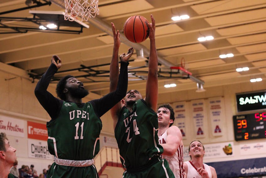The UPEI Panthers’ Abilash Surendran, 24, and Isaiah Ankra, 11, look to grab a rebound in an Atlantic University Sport (AUS) men’s basketball game against the host Acadia Axemen in Wolfville, N.S., on Nov. 5. The Panthers won the contest 90-74 to improve to 3-0 (won-lost). Jason Malloy • SaltWire Network