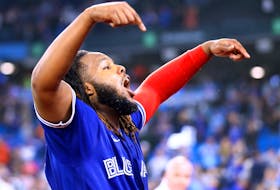 Vladimir Guerrero Jr.  of the Toronto Blue Jays celebrates his walk-off single in the 10th inning for a 3-2 win against the New York Yankees at Rogers Centre on September 26, 2022 in Toronto.