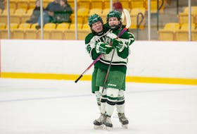 The UPEI Panthers’ Orianna MacNeil, left, and Mckinley Nelson celebrate a goal in an Atlantic University Sport (AUS) women’s hockey game against the Dalhousie Tigers at MacLauchlan Arena on Nov. 6. The Tigers won the game 3-2 in overtime. Janessa Hogan Photo • Courtesy of UPEI Athletics