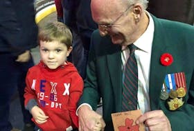 Hayden Ward when he was three years old, with Ira (Mac) MacDonald, who he says is his favourite veteran. - Contributed