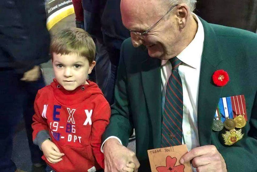 Hayden Ward when he was three years old, with Ira (Mac) MacDonald, who he says is his favourite veteran. - Contributed