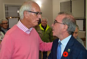 Mayoral candidate Cecil Villard, left, congratulates Philip Brown on winning another term as the mayor of Charlottetown in the Nov. 7 municipal election. Dave Stewart • The Guardian