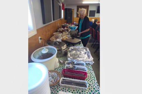 Nancy Greencorn helps set up for a gathering of the Shamrock Senior Citizens and Pensioners Club in Canso. The busy group offers plenty of events for people who are 50 and older. CONTRIBUTED