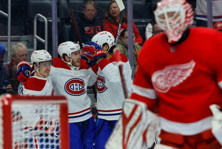 Canadiens left wing Mike Hoffman (68) receives congratulations from teammates after scoring in the first period against the Detroit Red Wings at Little Caesars Arena in Detroit on Nov. 8, 2022.