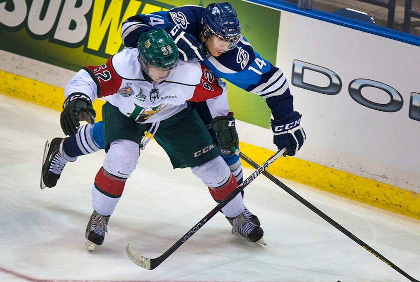  MacKenzie Weegar in action against the Saskatoon Blades while a member of the Halifax Mooseheads in 2013.