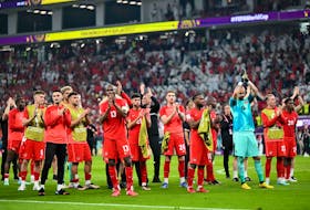 Canada players applaud supporters after they lost against Morocco at the Al-Thumama Stadium.