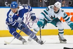Matt Nieto of the San Jose Sharks skates to check William Nylander of the Toronto Maple Leafs during an NHL game at Scotiabank Arena on November 30, 2022 in Toronto, Ontario, Canada. 