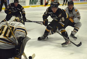 Ivan Ivan of the Cape Breton Eagles is stopped on a breakaway by Nathan Darveau of the Victoriaville Tigres during Quebec Major Junior Hockey League action at Centre 200 on Wednesday. The Tigres won the game 2-1. JEREMY FRASER/CAPE BRETON POST.