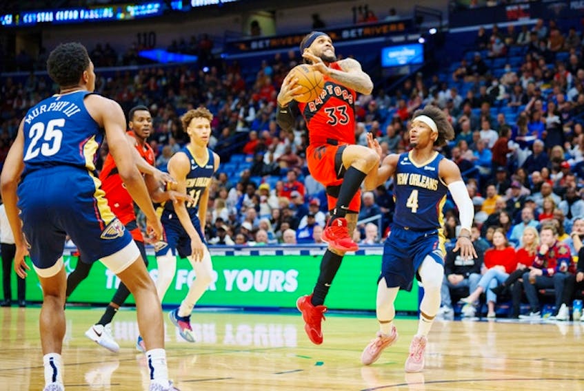 Raptors' Gary Trent Jr. shoots the ball against New Orleans Pelicans Devonte' Graham during the first quarter at Smoothie King Center on Wednesday, Nov. 30, 2022. 