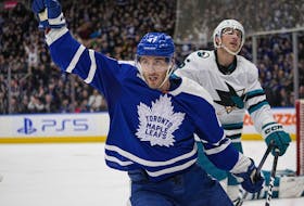 Toronto Maple Leafs forward Pierre Engvall reacts after scoring the winning goal as San Jose Sharks defenseman Matt Benning skates away during the third period at Scotiabank Arena.  