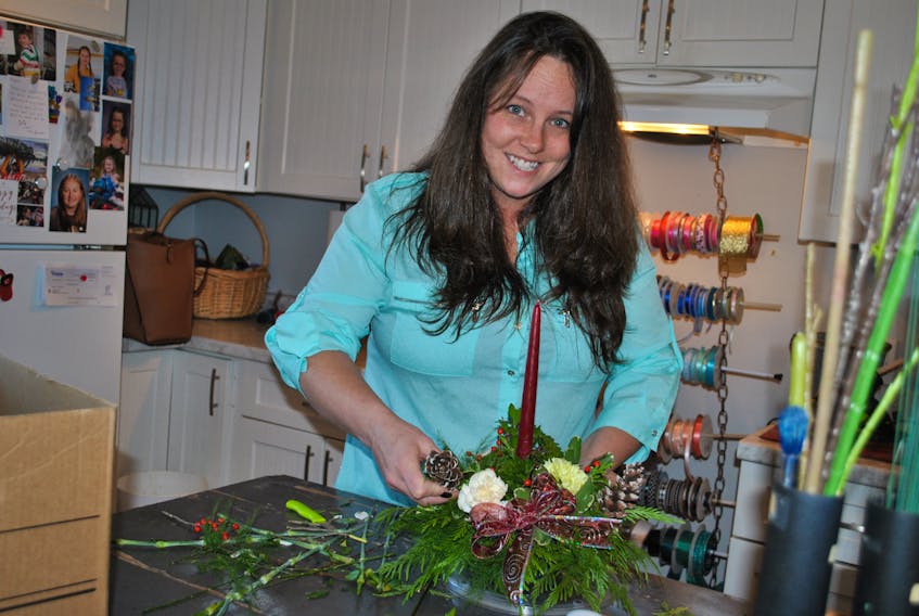 Cape Sable Island florist Sasha Huntley is helping to raise awareness about Juniper House, the Yarmouth based  transition house for abused women and children in Yarmouth, and the satellite offices they staff in the tri-counties, through Christmas centerpiece workshops that are part of this year’s Purple Ribbon Campaign. KATHY JOHNSON