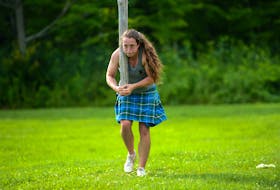 August 4, 2015--Susie Lajoie practices for the Caber toss during a Highland Games practice session at Fitness Experience in Middleton.  (INGRID BULMER/Staff)  Susie Lajoie practices for the caber toss during a Highland Games practice session at Fitness Experience in Middleton in August 2015. INGRID BULMER