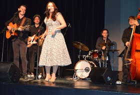 Jacob Hemphill, left, and Melissa MacKenzie perform a tune from the Songs of Johnny and June, which comes to The Mack as part of the Charlottetown Festival in 2023, during a news conference Dec. 1 where the summer lineup was announced. Other members of the band include Logan Richard on guitar, second from left, Connor Nabuurs on drums and Sam Langille on bass. Dave Stewart • The Guardian