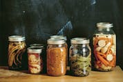  J-C Poirier recommends serving tourtière with pickled beets, gherkins and ketchup. (Various pickles and preserves from Where the River Narrows are pictured.)
