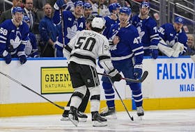 Maple Leafs forward Pierre Engvall and Los Angeles Kings defenseman Sean Durzi exchange words after a hit during the third period at Scotiabank Arena on Thursday night.