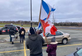 Jack and his daughter were among about a dozen protesters who showed up to the TrudeauMustGo protest in Dartmouth on Saturday.