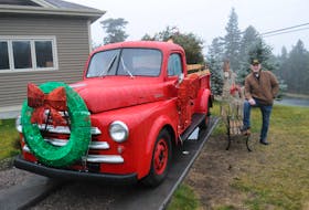 Shawn Butler’s home is well known for its festive Christmas displays. The Torbay resident is encouraging families to take photos next to his truck, asking that they only make a generous donation to the Torbay and area food bank. -Photo by Joe Gibbons/The Telegram